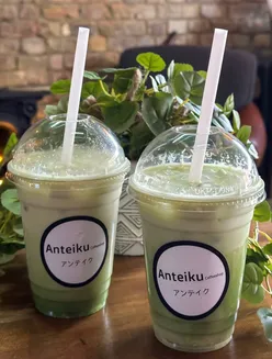 Two colorful matcha drinks at Anteiku Coffee Shop in Barking, known for its vibrant decor and customizable options.