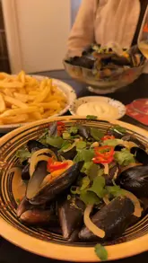 Plates of Thai and miso mussels with fries, craft beer, and wine at Marv's Ampthill for their Wednesday Mussels & Fries night.