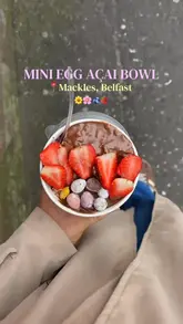 Mini egg and cornflake açai bowl with berries and edible flowers at Mackle's Ice Cream in Belfast, Northern Ireland.