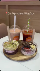 Healthy breakfast at Oh My Juice Windsor with Go Nuts Acai bowl, Berry Yummy Yogurt, Beet Root Juice, and Game Changer Smoothie.