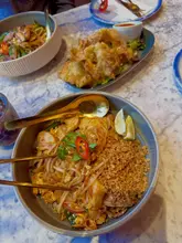 Chicken Pad Thai with soft noodles, juicy chicken, peanuts, and a side of crispy wontons, served at Spice Thai, Liverpool.