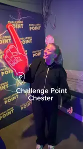 A fast-paced vlog featuring two creators visiting Challenge Point Chester, an interactive game venue. The video showcases various mini-games, including shooting challenges, trivia, and physical tasks, highlighting the fun and competitive nature of the experience.
