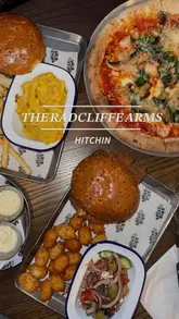 A promotional montage showcasing the interior, exterior, menu, and food offerings of The Radcliffe Arms, a pub and restaurant venue. The video highlights the dining area, bar, and various dishes.