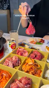 A spread of grilled beef, pork belly, and side dishes at Tayudo Korean BBQ buffet in Birmingham's Chinese Quarter.