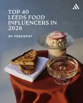 A promotional graphic for a listicle article featuring a photo of a rillette dish served on a glass stand with toasted bread and a glass of sparkling wine.