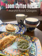 Guatemalan coffee, Tamal, goats cheese & pumpkin empanadas, and white chocolate alfajor at Loom Coffee House Glasgow.
