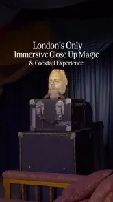 A magician performs an intimate close-up magic show for guests enjoying cocktails at The Magician's Table in London.