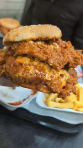 A short, text-led review of a spicy chicken burger from 3 in 1 Burger in Birmingham, focusing on the texture and sauce of the food.