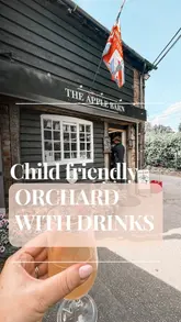 Family enjoying a blossom walk and fresh air at Dunham Apple Barn orchard, Altrincham, with woodfired pizza and cider.