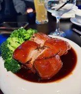 Braised pork and smashed cucumber salad on a table at Fresh Feast Chinese restaurant in Bristol.