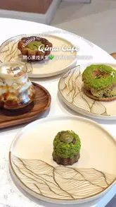 A short, polished montage featuring a variety of pistachio-based pastries and specialty drinks at Qima Cafe, focusing on the texture and presentation of the food.