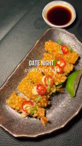 The video features a montage of various Japanese dishes, including ebi bites, yellowtail ceviche, and DIY handrolls, at Sticks'n'Sushi. It uses quick, rhythmic cuts to showcase the food preparation and presentation, interspersed with brief shots of the restaurant's interior.