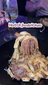 A short, energetic review of Notch Americano in Durham, featuring a variety of dishes including pasta, arancini, chicken wings, and desserts, alongside cocktails. The video uses a handheld vlog style to showcase the venue's interior and food offerings.