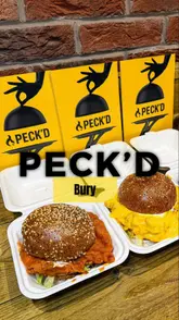 A short, punchy review of Peck'd in Manchester, focusing on their signature dipped burgers and loaded fries. The video features the creator trying the food, highlighting the messy, indulgent nature of the dishes, and providing a quick recommendation for viewers in the area.