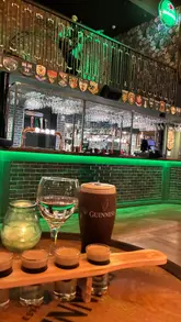 A short, upbeat video showcasing the atmosphere of Katie O'Brien's, a new Irish bar in Manchester. The reel features clips of the venue's interior, live music, a dance floor, and patrons enjoying drinks, specifically Guinness and baby Guinness shots.