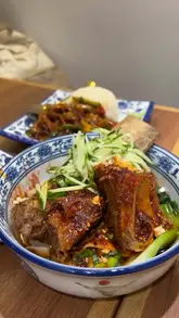 A fast-paced food review showcasing a variety of dishes at a Halal noodle spot in Soho, including knife-cut noodles, rib noodles, skewers, and a Chinese burger.