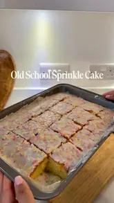 A home cooking tutorial demonstrating how to bake a nostalgic 'old school' sprinkle cake, featuring step-by-step mixing and icing.
