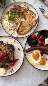 Layla's canal side cafe in Manchester, showing brunch dishes and outdoor seating perfect for warm days.
