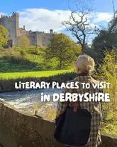 A high-quality, well-composed travel image featuring a person looking out at a historic castle across a river, serving as the cover for a listicle about literary-themed locations in Derbyshire.