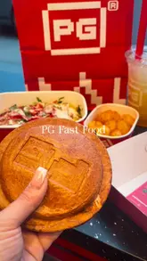 A short-form review of the 'UFO' burger concept at PG Fast Food, covering the ordering process at the kiosk and the final product presentation.