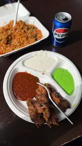 Here are a few options, playing on different aspects a "Kabuli Grill" might show, keeping the max 125 characters in mind:

**Option 1 (Focus on food variety):**
Kabuli Grill in Southall serving delicious Afghan and Pakistani grilled kebabs, lamb chops, and pilau rice.

**Option 2 (Focus on specific dishes):**
Authentic Afghan seekh kebabs, chicken tikka, and aromatic pilau rice at Kabuli Grill restaurant in Southall.

**Option 3 (Focus on dining experience):**
Diners enjoying mouth-watering grilled meats and traditional Afghan cuisine at Kabuli Grill in Southall.