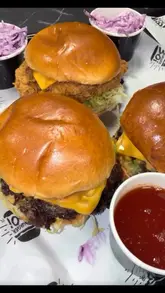 A short, energetic montage showcasing the food preparation and final presentation at a Burger Boi location, featuring smash burgers, loaded fries, and churros.