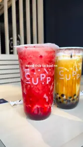 A short, fast-paced video showcasing bubble tea drinks and a katsu curry lunch box from a bubble tea cafe. The video features close-up shots of the drinks and food, along with a brief look at the menu board.