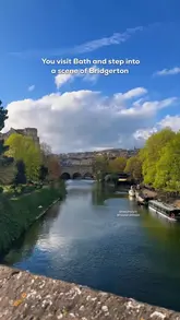 Here are a few options for your SEO alt text, keeping under the 125-character limit:

**Option 1 (Descriptive & SEO-focused):**
A scenic view of historic honey-colored stone architecture in Bath, England, a popular filming location for Bridgerton.

**Option 2 (Action-oriented):**
A tourist exploring the beautiful historic streets and architecture of Bath, England on a sunny day.

**Option 3 (Concise):**
Stunning historic buildings and Georgian architecture in Bath, UK, perfect for fans of Bridgerton travel.

**Tip:** Since you are a travel blogger, **Option 1** is generally the best for SEO as it includes the location and the Bridgerton keyword, which people frequently search for.