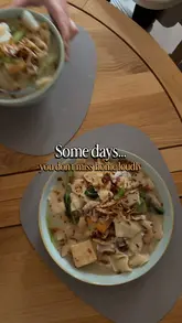 A visually appealing recipe video demonstrating the preparation of Mee Hoon Kueh, a traditional Malaysian noodle dish. The video follows the process from kneading the dough to assembling the final bowl with broth, vegetables, and toppings.