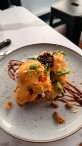 A montage of brunch dishes and specialty lattes at Pickle & Peach in South Shields, featuring close-ups of steak and eggs, a duck eggs benedict on a croissant, and creative lattes.