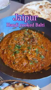 A short video review showcasing a new Handi cooked Balti dish at Jaipur restaurant, highlighting the portion size, flavor, and accompanying sides like naan and lamb.