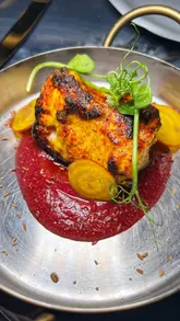 A high-quality montage showcasing the interior, cocktails, and a variety of Indian dishes at Vatavaran London. The video focuses on the presentation of the food and the ambiance of the venue.