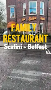 Here are a few options for your SEO alt text, keeping it under 125 characters:

**Option 1 (Descriptive & SEO-focused):**
A family enjoying a delicious Italian meal at Scalini restaurant in Belfast, featuring pizza and a kids menu.

**Option 2 (Action-oriented):**
A family dining at Scalini restaurant in Belfast, showcasing their affordable pizza and child-friendly menu.

**Option 3 (Concise):**
Family meal at Scalini restaurant in Belfast, highlighting their tasty Italian food and kids menu options.
