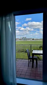 A montage-style tour of a hotel stay at the Delta Hotels by Marriott York, featuring the room, the view of the racecourse, the hotel restaurant, and the breakfast buffet.