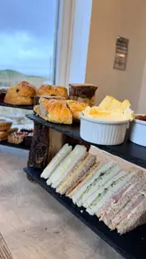 A short vlog-style video showcasing a visit to Stump Cross Caverns, featuring afternoon tea in the cafe and a tour of the caves with UV lighting effects.