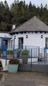 Here are a few options for your alt text (all under 125 characters):

* **Option 1 (Descriptive):** Delicious local seafood served on a plate with a stunning harbor view at The Pierhouse Hotel in Port Appin.
* **Option 2 (Contextual):** Fresh seafood lunch with a scenic coastal view at The Pierhouse Hotel, a perfect stop on the way to Mull and Iona.
* **Option 3 (Concise):** A plate of fresh seafood overlooking the water at The Pierhouse Hotel in Port Appin, near Oban.