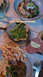 A montage of various dishes and cocktails served at No 197 Chiswick Fire Station, highlighting their bottomless dinner offering. The video features slow, steady shots of the venue's interior and close-ups of the food and drinks.
