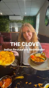A review of The Clove Indian restaurant in South Bristol, featuring a variety of dishes including Chicken 65, Goa King Prawn, and a special curry. The video highlights the menu variety, service, and overall dining experience.