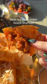 A short, punchy food review video showcasing South Indian dishes like dosa, biryani, and paneer 65 at a Sheffield food hall vendor. The video uses close-up, handheld shots to emphasise the texture and appeal of the food, accompanied by music and text overlays.