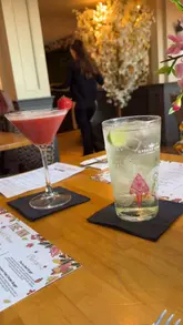 A video tour of The Inn at Belfairs, showcasing the interior decor, menu, drinks, and food dishes like brie bites, steak, and lamb shank.