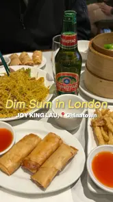 A personal vlog-style review of a visit to Joy King Lau in London's Chinatown, featuring a variety of dim sum dishes, Singapore noodles, and tea shared with a family member.