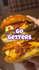 Here are a few options for your SEO alt text, depending on the focus:

**Option 1 (Descriptive & SEO-focused):**
"A delicious Cawsburger meal with fries delivered to a home by Go Getters food delivery service in Hertfordshire."

**Option 2 (Action-oriented):**
"Close up of a Cawsburger takeaway meal ordered through the local Go Getters food delivery app."

**Option 3 (Concise):**
"A hot Cawsburger meal from a local restaurant delivered by Go Getters."

**SEO Tip:** I included "food delivery" and the brand name "Go Getters" as these are the most important keywords for your search ranking.