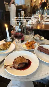 A short, engaging reel showcasing a dinner experience at a French bistro. The video features a variety of dishes including steak, duck, and desserts, set against a moody, candlelit backdrop.
