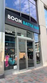 Here are a few options for your alt text, keeping it under 125 characters:

**Option 1 (Descriptive & SEO-focused):**
"Woman enjoying carbonara bites and cocktails at Boom Battle Bar, a fun venue for dining and games."

**Option 2 (Action-oriented):**
"Close-up of delicious carbonara bites and drinks at Boom Battle Bar, the perfect spot for a weekend treat."

**Option 3 (Concise):**
"A table of carbonara bites and drinks at Boom Battle Bar, a great local destination for food and fun."

**SEO Tip:** I included "Boom Battle Bar" and "carbonara bites" as these are your most important keywords for local search and social discoverability!