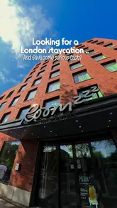 Here are a few options for your alt text, depending on what is actually shown in the image:

**Option 1 (Focus on the apartment interior):**
Stylish, modern living room and kitchen area inside a Roomzzz serviced apartment at London Stratford.

**Option 2 (Focus on the brand/vibe):**
Guest relaxing in a contemporary, home-style serviced apartment at Roomzzz London Stratford.

**Option 3 (More descriptive for SEO):**
Cozy and modern serviced apartment interior at Roomzzz London Stratford, perfect for city breaks and group stays.

**SEO Tip:** If the image shows a specific part of the room (like a bed or the kitchenette), swap "living room" for that specific item to make it even more relevant!