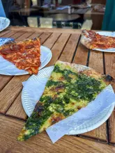 Here are a few options for your alt text, depending on where you are posting:

**Option 1 (Descriptive & SEO-focused):**
"A variety of pizza slices including pepperoni, spanakopita, and vodka sauce from Vincenzo’s Pizza in Shoreditch, London."

**Option 2 (Action-oriented):**
"Close-up of delicious artisan pizza slices from Vincenzo’s Pizza in Shoreditch, perfect for a post-marathon meal."

**Option 3 (Concise):**
"Assorted pizza slices from Vincenzo’s Pizza in Shoreditch, featuring pepperoni, spanakopita, and vodka sauce."

**SEO Tip:** Since you mentioned the "marathon," including the location ("Shoreditch") and the specific shop name ("Vincenzo's Pizza") is the most important part for search visibility.