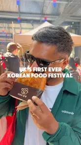Here are a few options for your SEO alt text, all under 125 characters:

**Option 1 (Focus on variety):**
Crowds enjoying Korean street food like BBQ skewers and fried chicken at the Jung Festival at London’s Canopy Market.

**Option 2 (Descriptive & SEO-focused):**
A busy stall at London's first Korean Food Festival at Canopy Market serving authentic dishes and Korean street food.

**Option 3 (Short & punchy):**
Foodies eating Korean BBQ skewers and fried chicken at the popular Jung Festival in London’s King's Cross.

**SEO Tip:** I included "Korean Food Festival," "London," and "Canopy Market" in these, as those are the high-value keywords for your post.