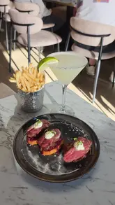 The video is a listicle-style compilation of the creator's top five dining experiences in the North East for the month of April. It features a variety of venues, including a sandwich shop, a bao cafe, a hotpot restaurant, a bar and bistro, and an Asian street food spot. The creator provides voiceover commentary for each, highlighting specific dishes and the overall vibe of each location.