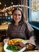 Here are a few options for your SEO alt text, keeping it under 125 characters:

**Option 1 (Descriptive & SEO-focused):**
A delicious spread of vegan small plates and a Lions Mane mushroom steak with chips at The Spread Eagle London.

**Option 2 (Focus on the standout dish):**
Lions Mane mushroom steak with homemade chips and a variety of spring small plates at The Spread Eagle London.

**Option 3 (Concise & punchy):**
A colorful spring menu feast featuring a Lions Mane mushroom steak and crispy chips at The Spread Eagle London.

**SEO Tip:** Including the name of the venue ("The Spread Eagle London") and the key dish ("Lions Mane mushroom steak") will help your image rank better for people searching for those specific terms.