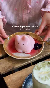 Here are a few options for your alt text, depending on the specific focus of the image:

**Option 1 (Focus on the dessert):**
"Wobbly jelly bunny dessert at Tokyo Bagel on Lower Marsh in London"

**Option 2 (Comprehensive):**
"Freshly baked pastries and a wobbly jelly bunny dessert served at Tokyo Bagel cafe in London"

**Option 3 (Action-oriented):**
"Cute viral jelly bunny dessert served with a specialty latte at Tokyo Bagel London"

**SEO Tip:** I recommend **Option 1 or 2** as they include the location ("London" and "Lower Marsh"), which helps with local SEO discovery.